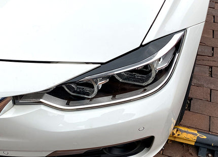 Strålkastarögonbryn i blanksvart för BMW 3-serie F30/F31