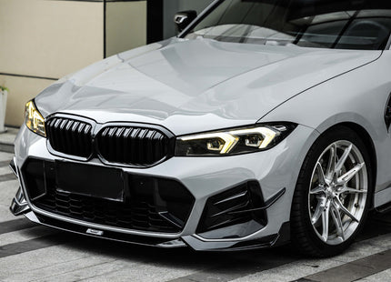Frontsplitter i blanksvart med stötfångarfenor för BMW 3-serie G20 Facelift