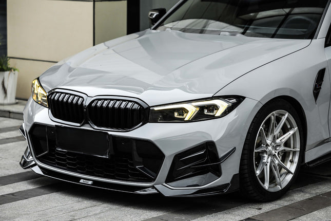 Frontsplitter i blanksvart med stötfångarfenor för BMW 3-serie G20 Facelift